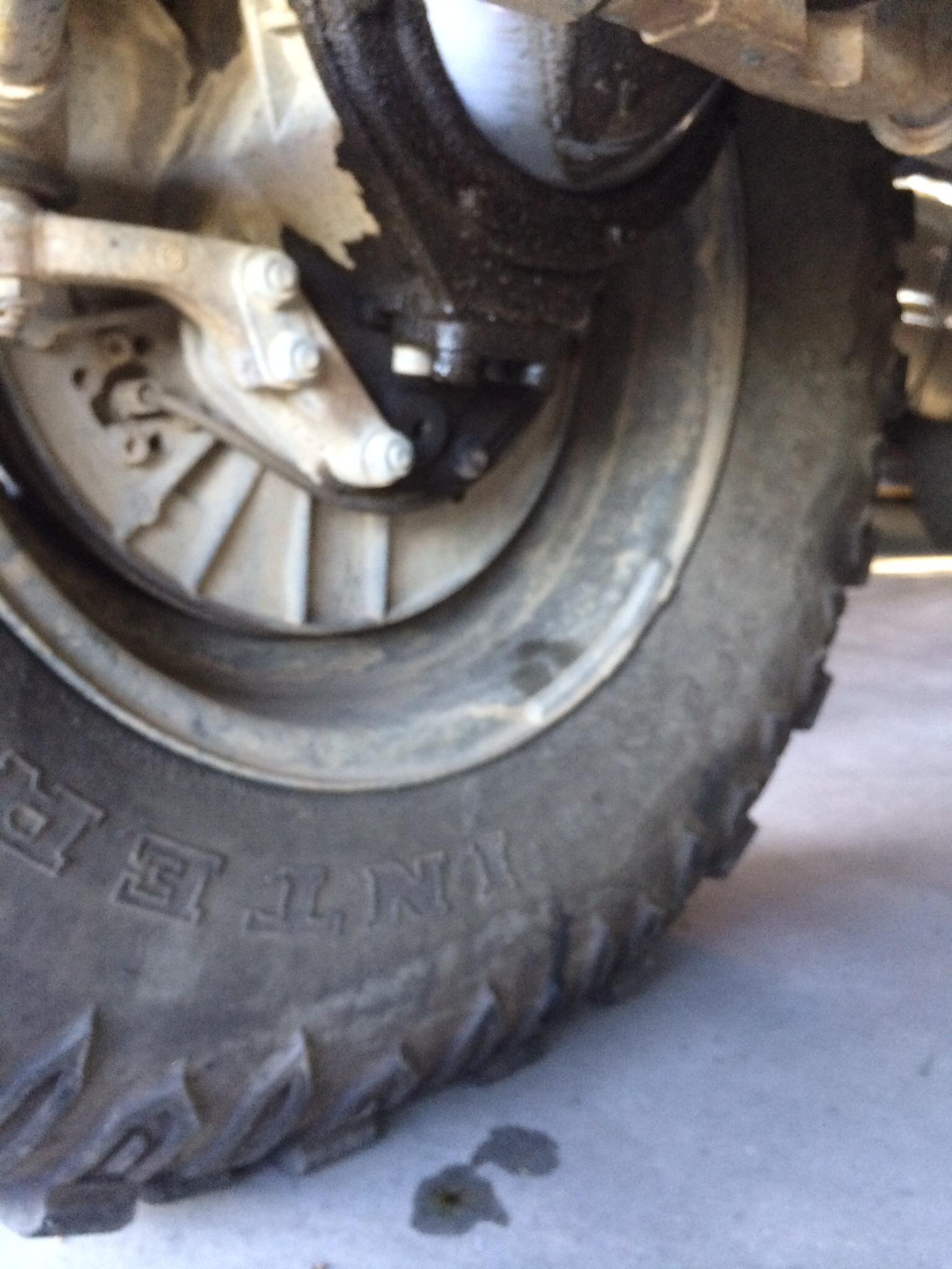 Front passenger portal, dripping off of the front bolt going upward just in front of the inspection plug