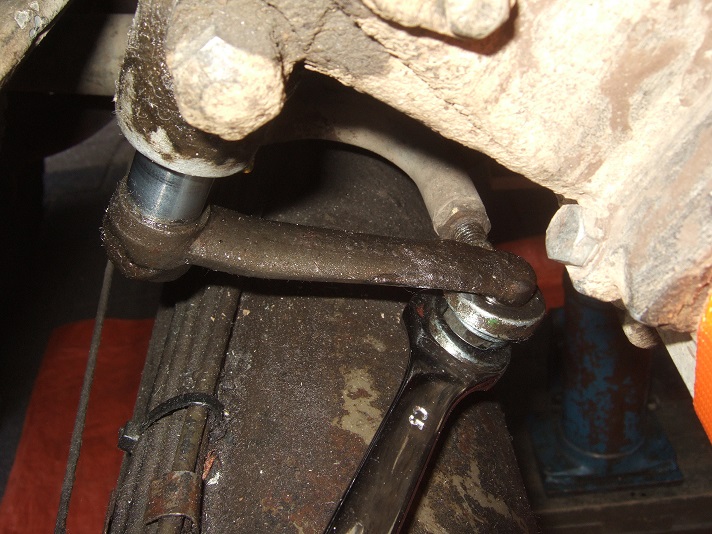5 - Remove the nut (size 19) that connects the gear-shifting-rod to the gear-selector-arm of the gearbox. Keep the ring under the nut together with the nut !!